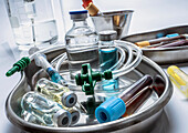 Vials and blood samples in a metal tray