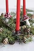 Advent wreath made from hemlock with red candles