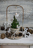 Mini conifer tree with feather snowflake and cotton deer figurine