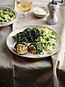 Savoy cabbage roulades with chicken filling and broccoli-celery mash