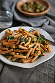 Lentil pasta with olives and spinach