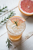 Cocktail with gin, vodka, and pink grapefruit