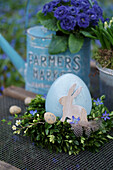 Beech wreath with a ceramic egg, quail egg and rabbit figurine