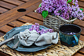 Spring place setting with purple flowers on an outdoor table
