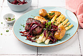 Steak with white asparagus and boiled potatoes