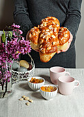 Colomba - traditional italian easter cake with almonds, in the woman s hands