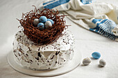 Easter cake decorated with chocolate nest and Easter eggs