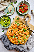 Focaccia with tomato and basil sauce