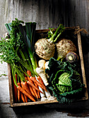 Fresh vegetables in rustic wooden box