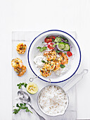 Tandoori prawn skewers with rice and chopped salad