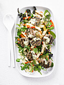 Roasted root vegetable salad with turkey fritters and parmesan dressing