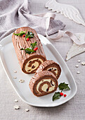 Creamy Christmas Yule log roll with dried fruits