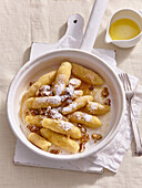 Sweet potato gnocchi with walnuts and confectionery sugar