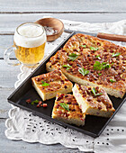Spicy potato sheet cake with bacon and garlic