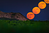 Moonrise crossing inversion layer showing red lunar flash