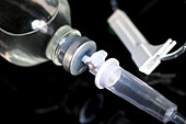 Glass IV bottle, flow adjustor and IV tubing
