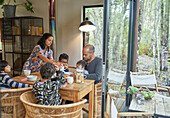 Family eating at dining table in cabin