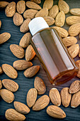 Essential almond oil on a wooden table