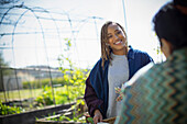 Happy woman with friend in garden