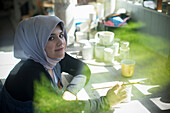 Female Muslim artist in art studio