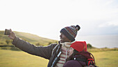 Hiker couple taking selfie with camera phone
