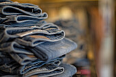 Denim jeans stacked in shop