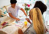 Family painting at table