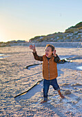 Happy with Down Syndrome playing with bubbles on beach