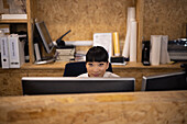 Smiling businesswoman working at computer