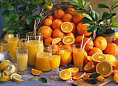 Still life with citrus fruits and freshly squeezed juices