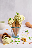 Pistachio ice cream with mint in waffle cones