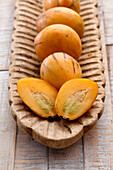 Pepino mini melons on wooden tray