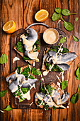 Toasts with herring spinach mustard lemon sauce