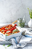Gnocci with tomato and pepper sauce, pesto and roasted tomatoes