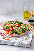 Green salad with strawberries, grilled goats cheese, hezelnuts and balsamic vinaigrette