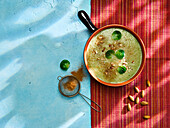 Creamy Brussels sprout soup with almonds
