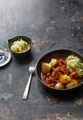 Iberico goulash with chanterelles and pointed cabbage salad