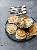 Filled pancakes with egg liqueur cream and nut ice cream