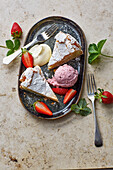 Vanilla cake with strawberry ice cream and mascarpone vanilla cream