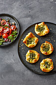 Wild herb quiche with tomato salad and dandelion capers