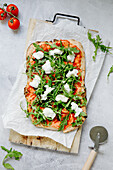 Pizza with rocket and mozzarella cheese