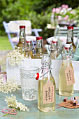 Elderflower syrup in glass bottles with labels