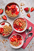 Granola with yoghurt roasted rhubarb and strawberries