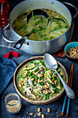 Vegan green curry soup with rice noodles
