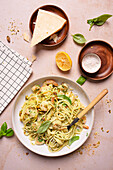 Spaghetti in lemon-pistachio sauce with prawns and parmesan cheese