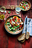 Pepper and feta bread salad with dandelions