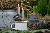 Winter decoration with candles on a planting table