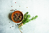 Spices and rosemary herb on concrete background