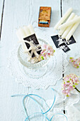 White candles tied with lace and a black-and-white photo