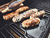 Homemade sausages without intestines on a grill